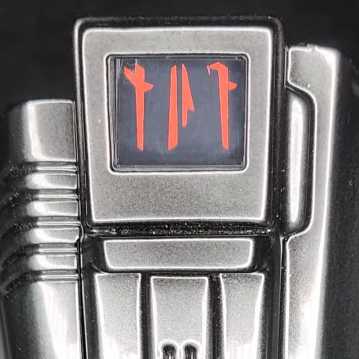 MandoPuter gauntlet display module showing red Mandalorian glyphs on a 1.3-inch LCD screen