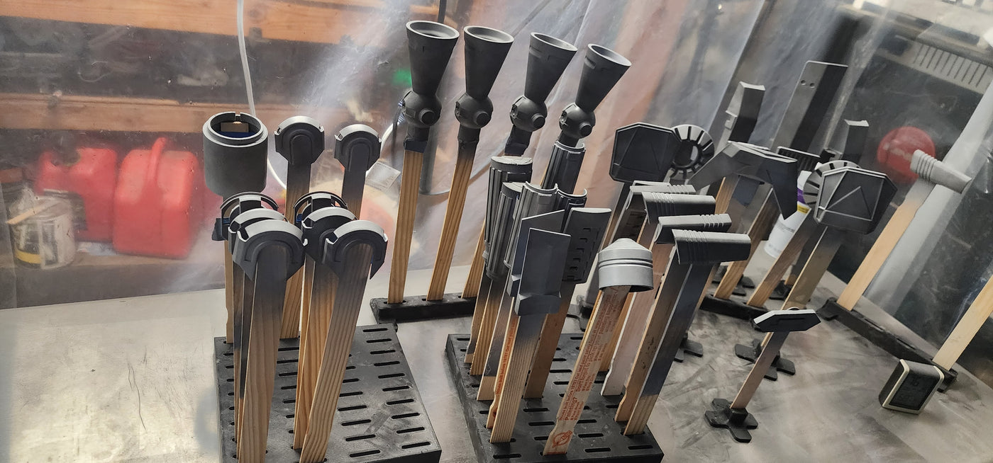 Paint work holders in use on a workbench