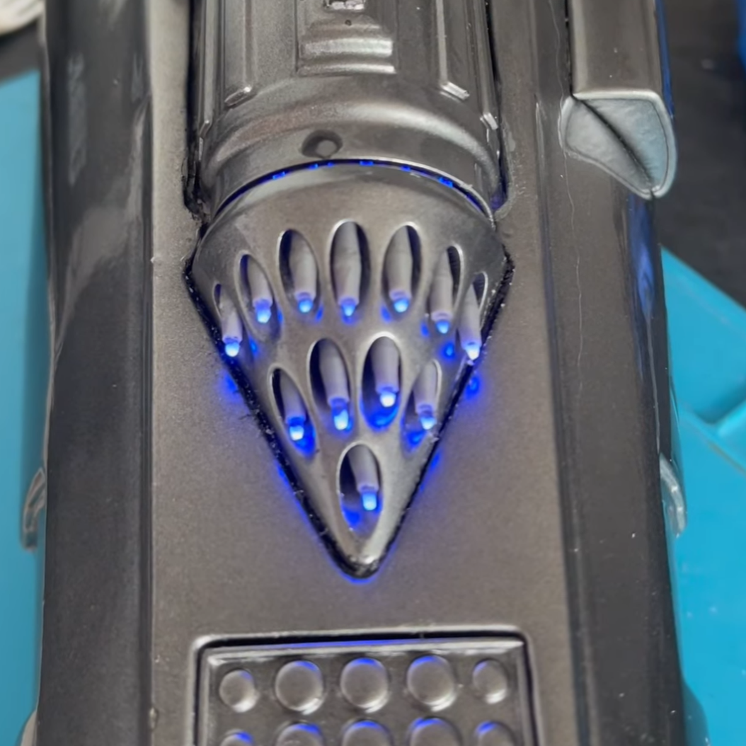 Finished gauntlet with lit whistling birds and beskar dart tips