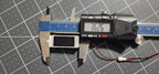 Digital caliper measuring the box speaker length at 36 mm, JST plug beside it