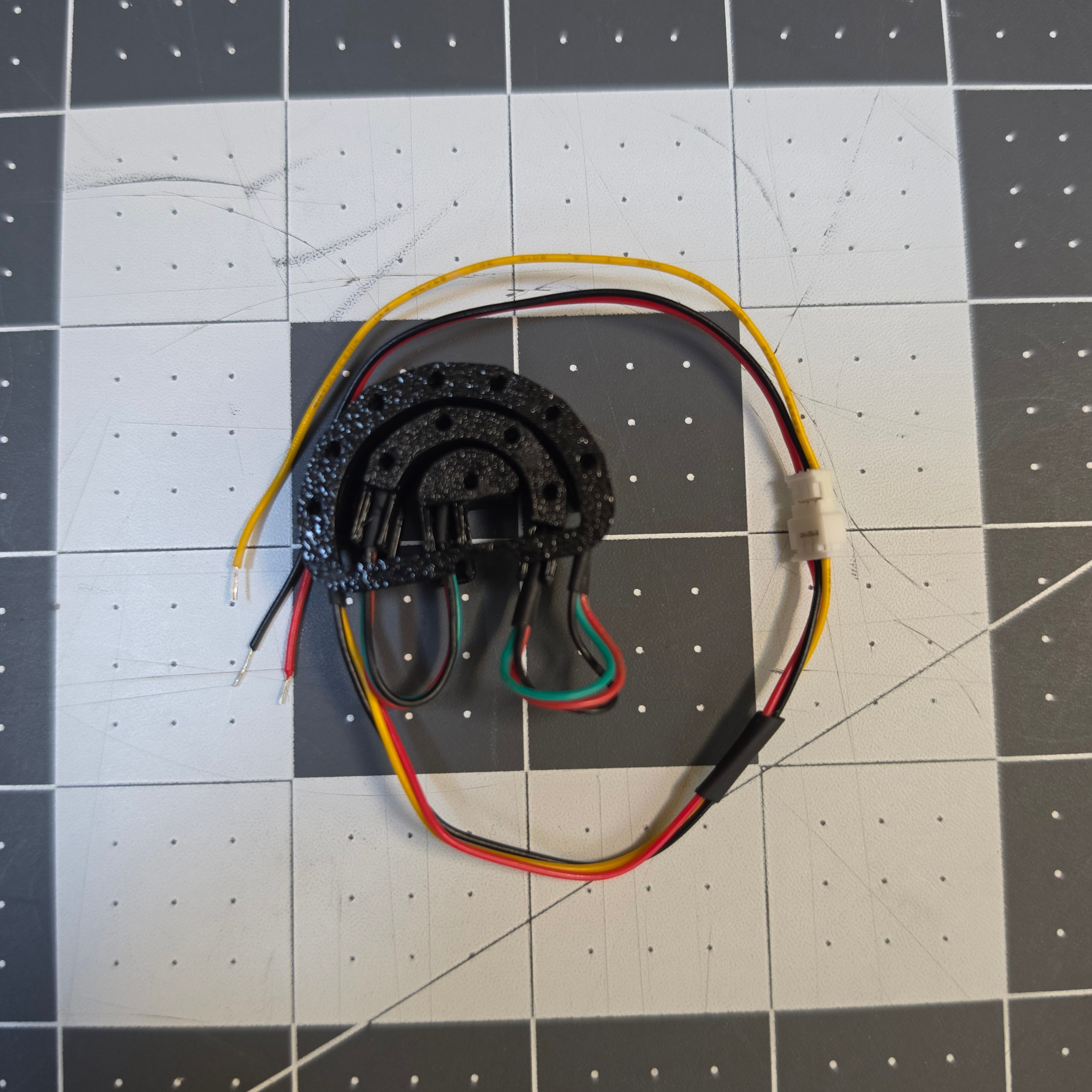 Presoldered v2.5 LED housing with its wiring harness and JST connector